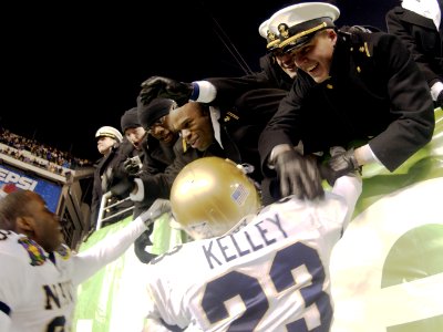 US Navy 031206-N-9693M-533 U.S. Naval Academy Midshipmen congratulate defensive back Vaughn Kelley on a win following the 104th Army Navy Game photo