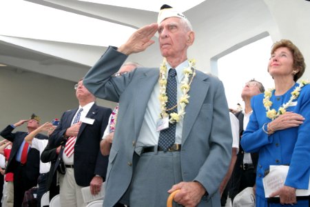 US Navy 031207-N-3228G-013 Pearl Harbor survivor Dr. Rodney T. West joins other invited guests in rendering honors photo