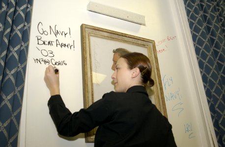 US Navy 031113-N-9693M-001 Yeoman 2nd Class Tianni Craig writes on the wall