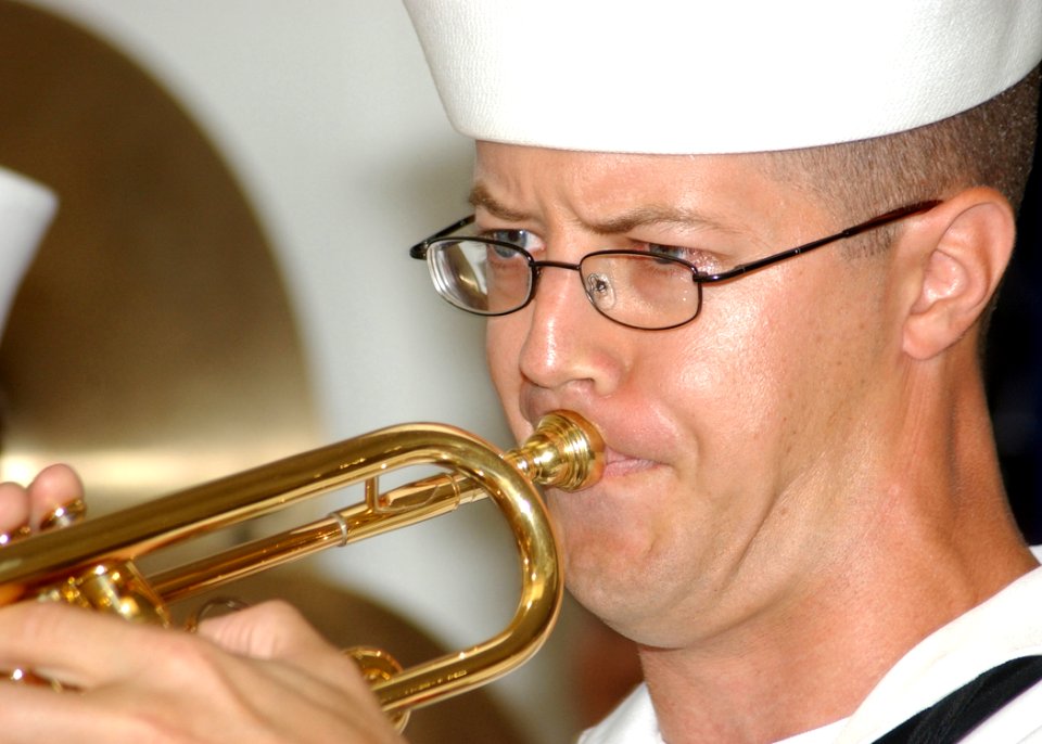 US Navy 031207-N-7391W-060 Musician 2nd Class Guy Gregg assigned to the Pacific Fleet Band plays a trumpet during the 62nd anniversary of the attack on Pearl Harbor, at the USS Arizona Memorial