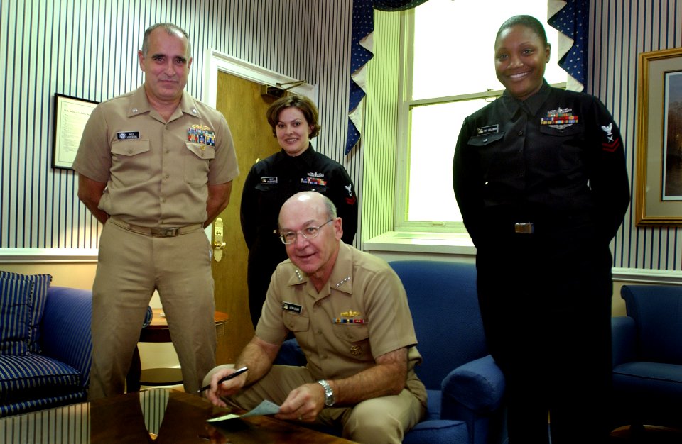 US Navy 031106-N-2383B-013 Adm. Vern Clark, Chief of Naval Operations (CNO) signs his Combined Federal Campaign (CFC) pledge card