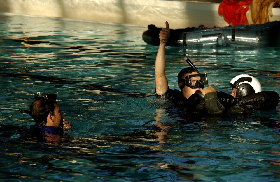 US Navy 031112-N-5862D-077 Students at the Aviation Rescue Swimmer School simulate pilot recovery procedures