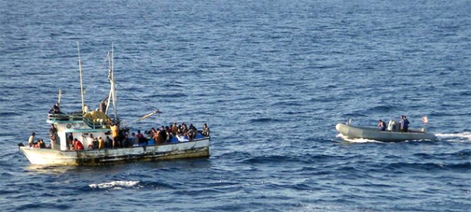 US Navy 031212-N-6073L-020 Sailors aboard a Rigid Hull Inflatable Boat (RHIB) assigned to guided missile frigate USS McClusky (FFG 41) approach the distressed vessel