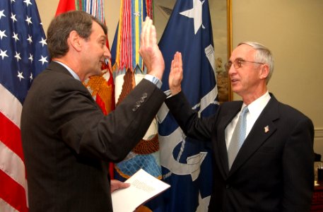 US Navy 031001-N-2568S-002 The Honorable Gordon R. England, right, receives the oath of office, during a short swearing in ceremony as the 73rd Secretary of the Navy