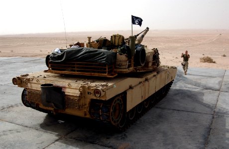 US Navy 031214-N-3236B-008 A Marine from the 13th Marine Expeditionary Unit (13th MEU) Tank Platoon BLT 1-1 stationed at Twentynine Palms, Calif., directs an M1-A1 Abrams tank during a training exercise