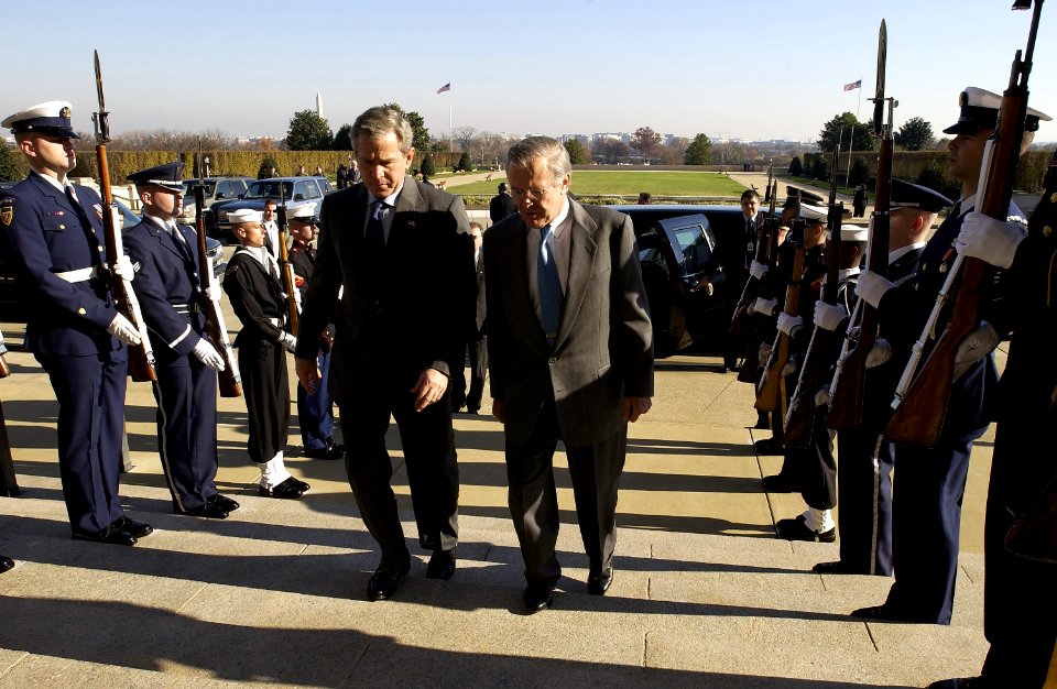 US Navy 031124-F-2828D-148 Secretary of Defense Donald H. Rumsfeld escorts President George W. Bush into the Pentagon to sign the Defense Authorization Act with Secretary Rumsfeld