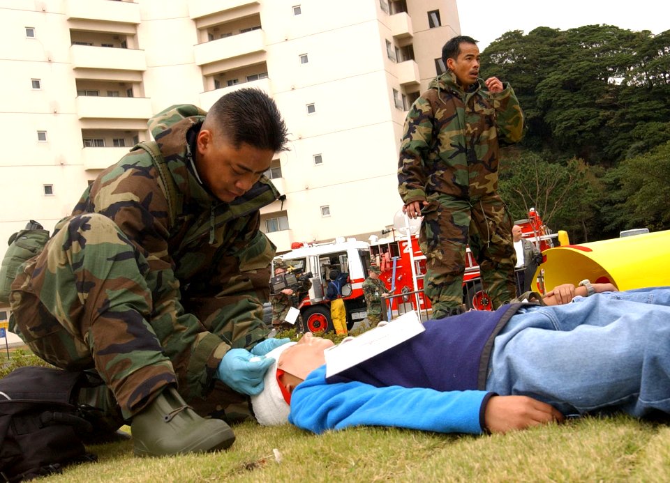 US Navy 031105-N-0000W-002 Members of Yokosuka's Special Medical Operations Response Team help triage, treat, and evacuate middle school students in a simulated mass casualty drill