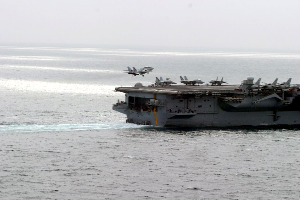 US Navy 031215-N-1302W-354 An F-14 assigned to the Checkmates of Fighter Squadron Two One One (VF-211) makes an arrested landing aboard USS Enterprise (CVN 65)