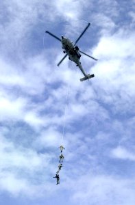 US Navy 031005-N-2385R-004 Explosive Ordnance Disposal Mobile Unit Eleven Detachment One (EODMU-11, DET 1) suspend themselves from a repelling rope photo