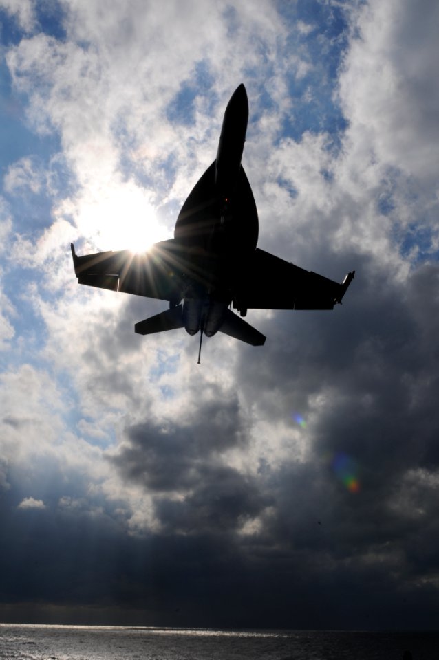 US Navy 101209-N-9693M-005 An F-A-18E Super Hornet approaches USS Enterprise (CVN 65) for an arrested landing