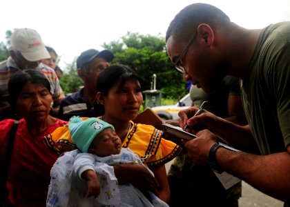 US Navy 101001-N-1531D-043 Cpl. Hector Reyes checks patients into a Continuing Promise 2010 medical community service event photo