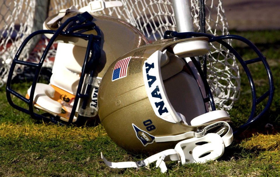 US Navy 031230-N-9693M-001 A pair of Navy helmets lays on the field prior to the EV1.Net Houston Bowl at Reliant Stadium in Houston, Texas