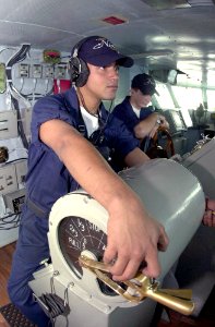 US Navy 031015-N-2385R-005 Seaman Juan Alicianieves from Bonce, Puerto Rico, stands the lee helmsman watch