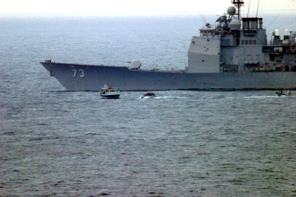 US Navy 031231-N-2295R-001 Boarding teams from USS Port Royal (CG 73) and the 13th Marine Expeditionary Unit (Special Operations Capable) assigned to Expeditionary Strike Group One (ESG 1) approach a dhow suspected of drug traf
