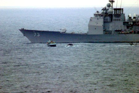 US Navy 031231-N-2295R-001 Boarding teams from USS Port Royal (CG 73) and the 13th Marine Expeditionary Unit (Special Operations Capable) assigned to Expeditionary Strike Group One (ESG 1) approach a dhow suspected of drug traf