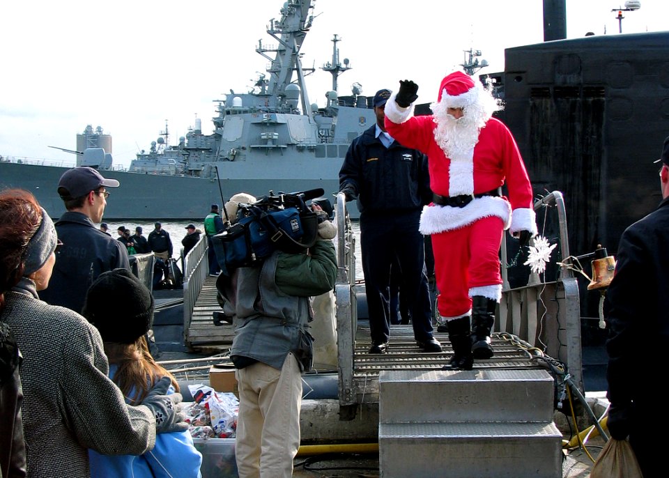 US Navy 031219-N-2903K-001 Santa Claus comes across the brow from the nuclear powered Los Angeles class attack submarine USS Jacksonville (SSN 699) after the submarine returned home to Naval Station Norfolk from a three-month d