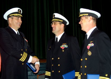US Navy 031203-N-2903K-001 Three commanding officers of Norfolk-based submarines congratulate each other after being