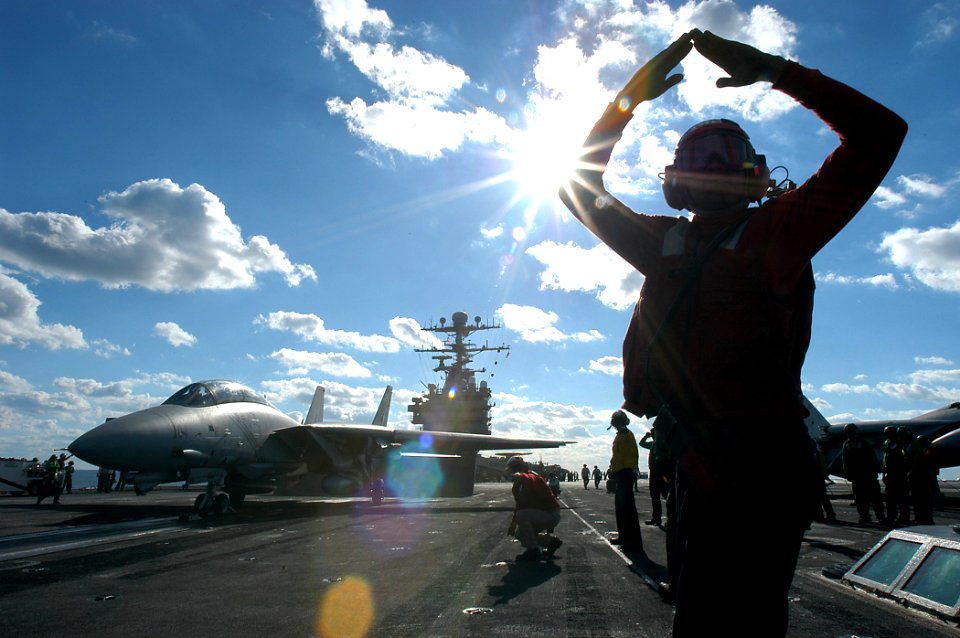 US Navy 031121-N-3986D-003 Aviation Ordnanceman 3rd Class Quadar Edwards from Morristown, N.J., signals hands off controls