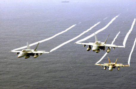 US Navy 031026-N-6536T-005 F-A-18A Hornets fly over the Western Pacific Ocean during flight operations