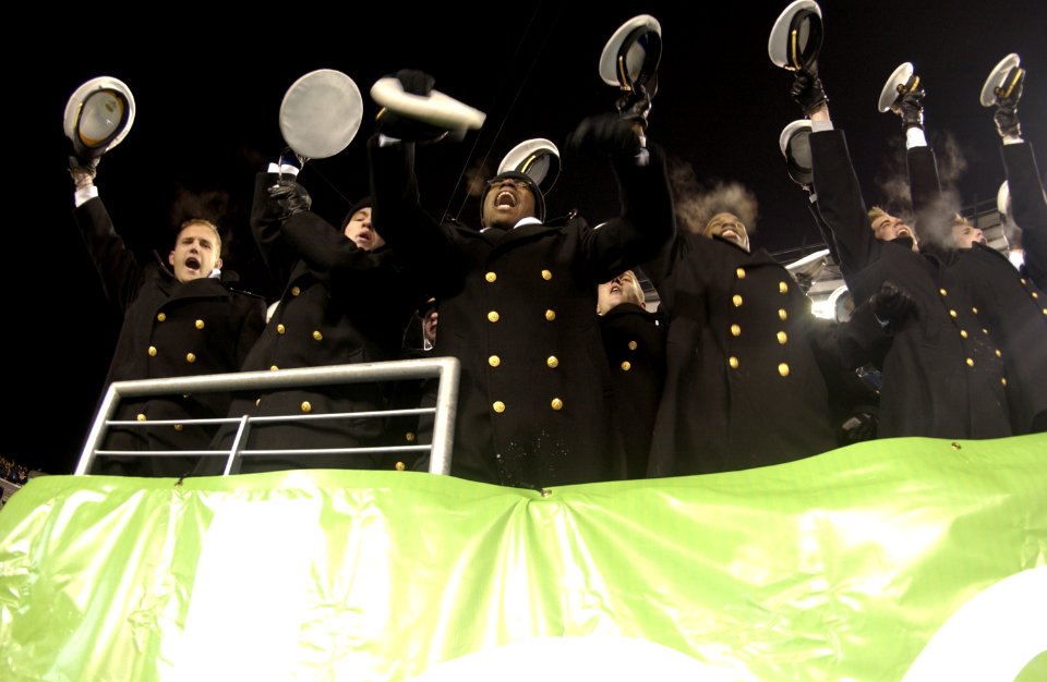 US Navy 031206-N-9693M-034 A group of Midshipmen cheer for their team following the conclusion of the 104th Army Navy Game