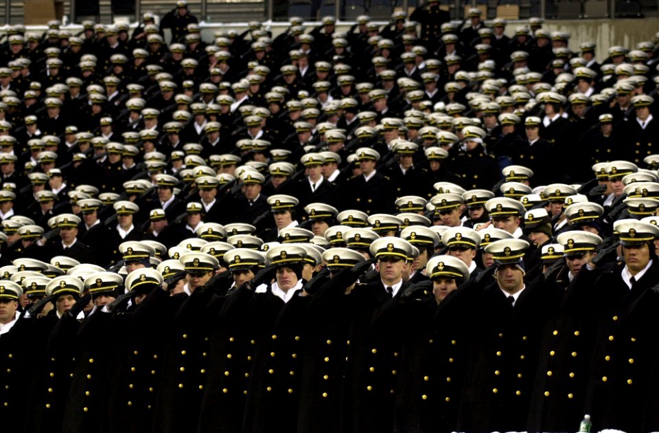 US Navy 031206-N-9693M-027 The U.S. Naval Academy Brigade of Midshipmen salutes during the playing of the National Anthem prior to the 104th playing of the Army Navy game