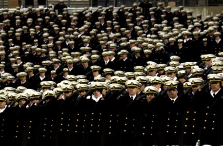 US Navy 031206-N-9693M-027 The U.S. Naval Academy Brigade of Midshipmen salutes during the playing of the National Anthem prior to the 104th playing of the Army Navy game photo