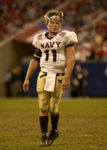US Navy 031230-N-9693M-021 Navy quarterback Craig Candeto recovers from a tough rushing attempt which ended in a tackle that jarred his helmet loose in the EV1.Net Houston Bowl at Reliant Stadium in Houston, Texas