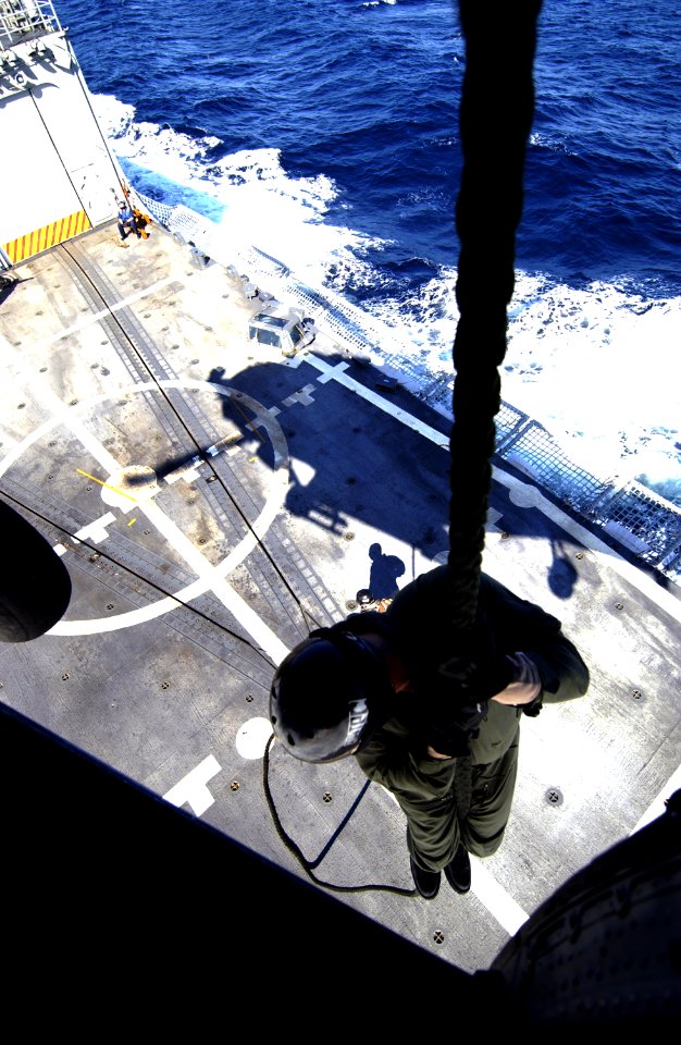 US Navy 031209-N-5319A-012 Gunner's Mate 1st Class Casey Rodgers and Diver Jason Erickson from Explosive Ordnance Disposal Mobile Unit Six (EODMU 6) fast rope down