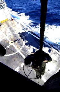 US Navy 031209-N-5319A-012 Gunner's Mate 1st Class Casey Rodgers and Diver Jason Erickson from Explosive Ordnance Disposal Mobile Unit Six (EODMU 6) fast rope down