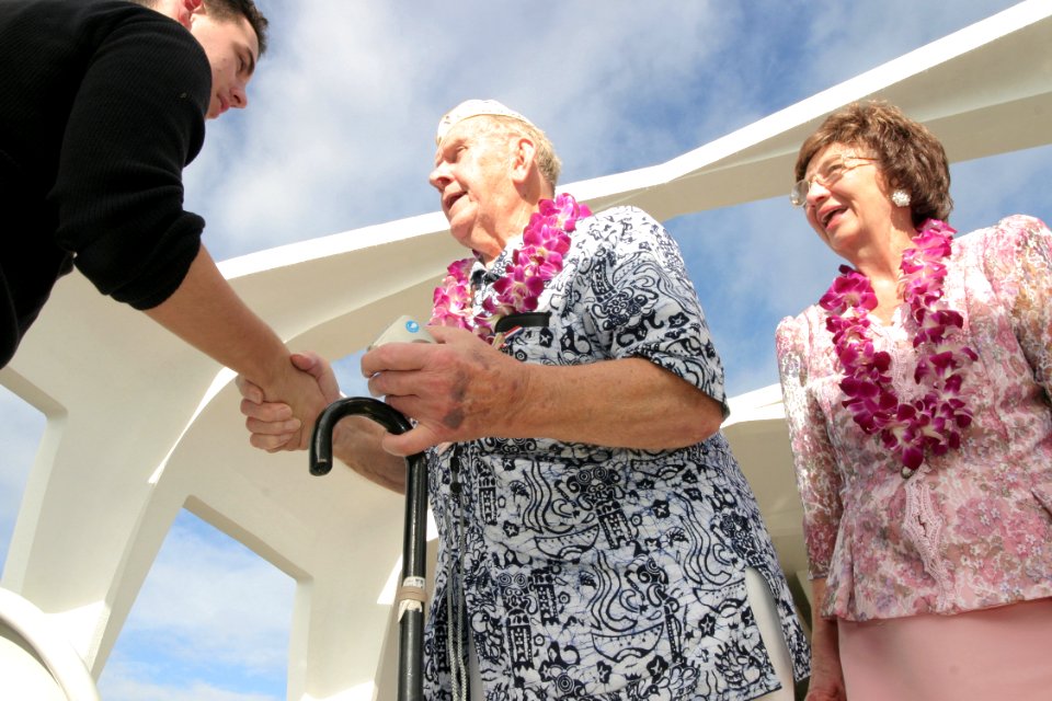 US Navy 031207-N-3228G-029 Pearl Harbor survivor John Latko shakes hands with other guests