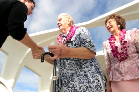 US Navy 031207-N-3228G-029 Pearl Harbor survivor John Latko shakes hands with other guests photo