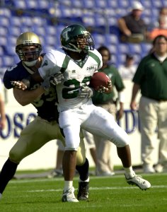 US Navy 031101-N-9693M-363 Navy safety Josh Smith wraps up Tulane running back Jovon Jackson during Navy's 35-17 victory over Tulane