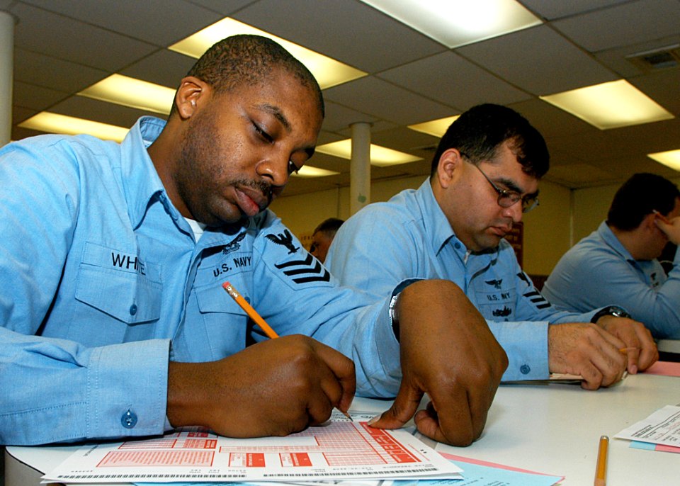 US Navy 040115-N-2972R-007 Aviation Boatswain's Mate 1st Class Terrance White, left, and Aviation Structural Mechanic 1st Class Albert Ramirez assigned to USS Kearsarge (LHD 3)