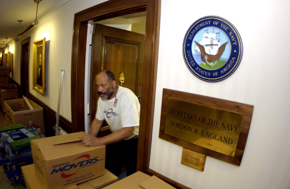 US Navy 031113-N-9693M-003 Danny Brooks pushes boxes out of the office