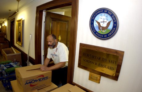 US Navy 031113-N-9693M-003 Danny Brooks pushes boxes out of the office