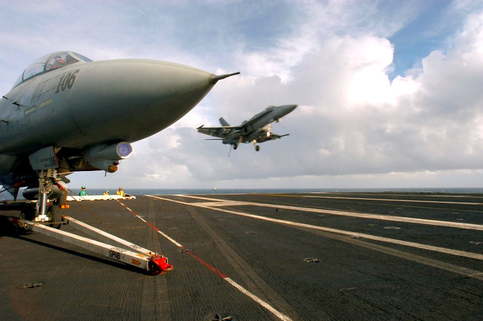 US Navy 040128-N-3986D-003 An F-A-18C Hornet assigned to Carrier Air Wing Seven (CVW-7) prepares to make an arrested landing on the flight deck aboard USS George Washington (CVN 73)
