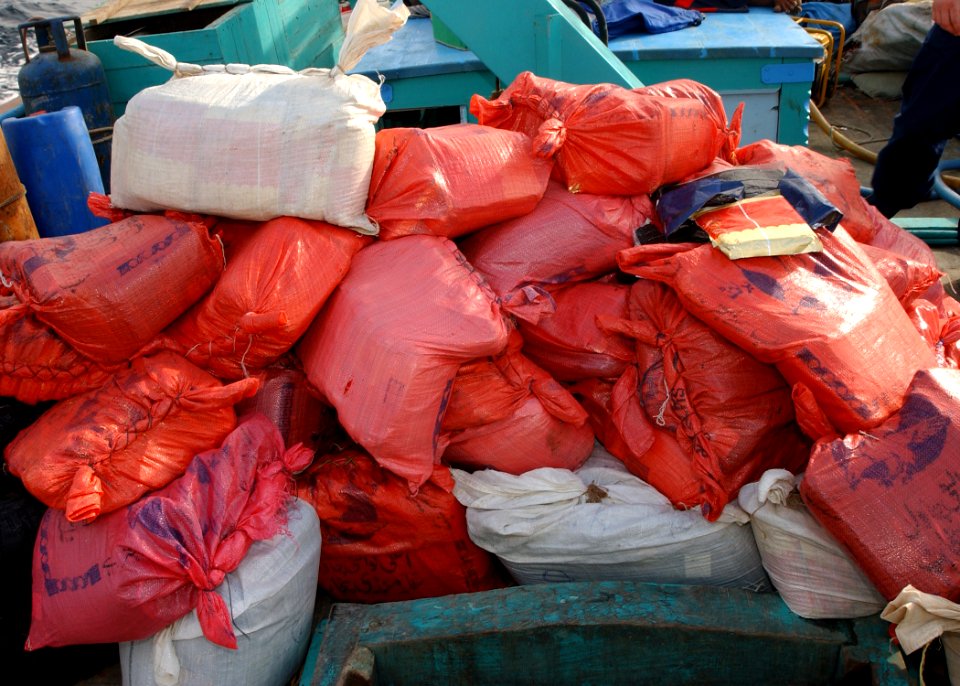 US Navy 031216-N-4374S-030 A U.S. Navy boarding team operation from the guided missile destroyer USS Decatur (DDG 73) discovered over 50 bags of hashish, weighting 70 pound each