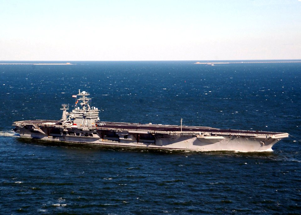 US Navy 040120-N-6278K-001 USS George Washington (CVN 73) sails past the Chesapeake Bay Bridge tunnel into the Atlantic Ocean to start her deployment
