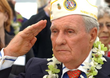 US Navy 031207-N-7391W-052 Authur Forcier, Hawaii's State Commander of the Disabled American Veterans, salutes the national ensign during the 62nd anniversary of the attack on Pearl Harbor