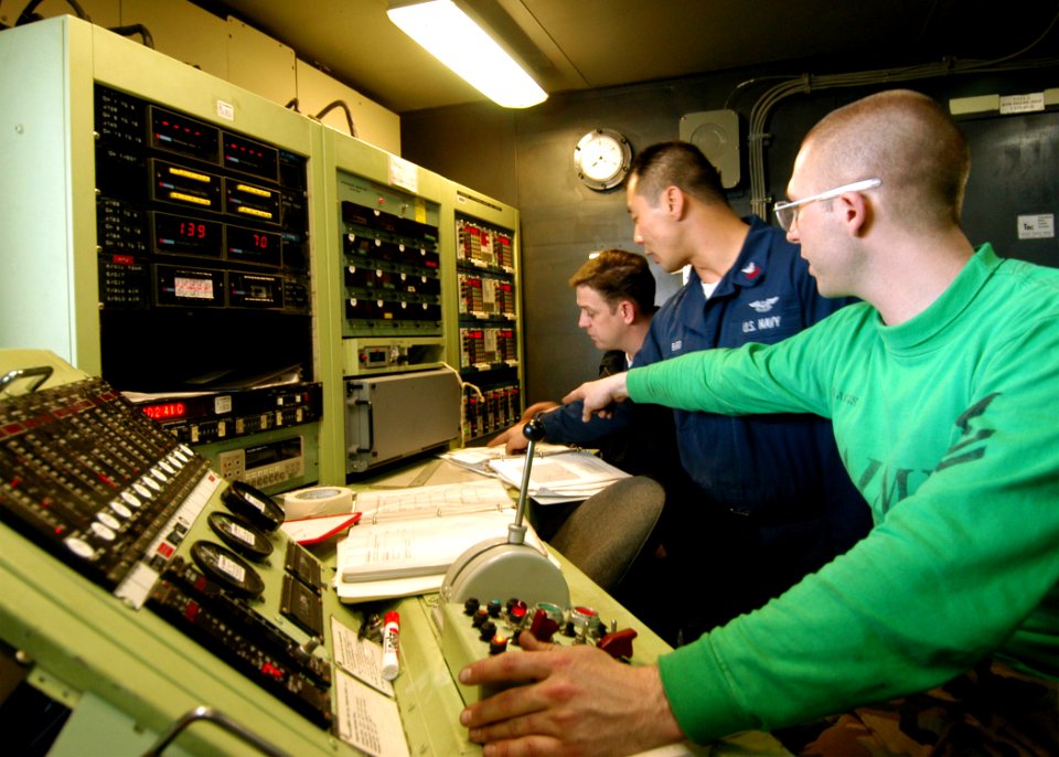 US Navy 040124-N-6278K-002 Aviation Machinist's Mates assigned to Aircraft Intermediate Maintenance Department's jet shop aboard USS George Washington (CVN 73) receive data