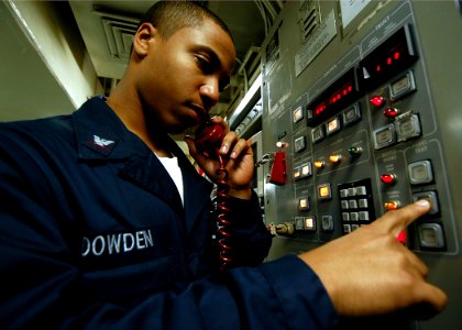 US Navy 040210-N-6278K-001 Information Systems Technician 3rd Class Anthony Dowden from Brooklyn, N.Y., conducts a communications check on a UHF circuit aboard USS George Washington (CVN 73)