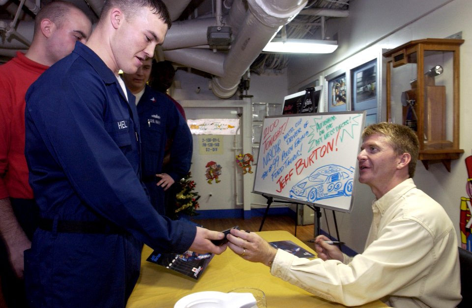 US Navy 031210-N-5319A-003 NASCAR driver Jeff Burton signed autographs on the mess decks aboard USS George Washington (CVN 73)