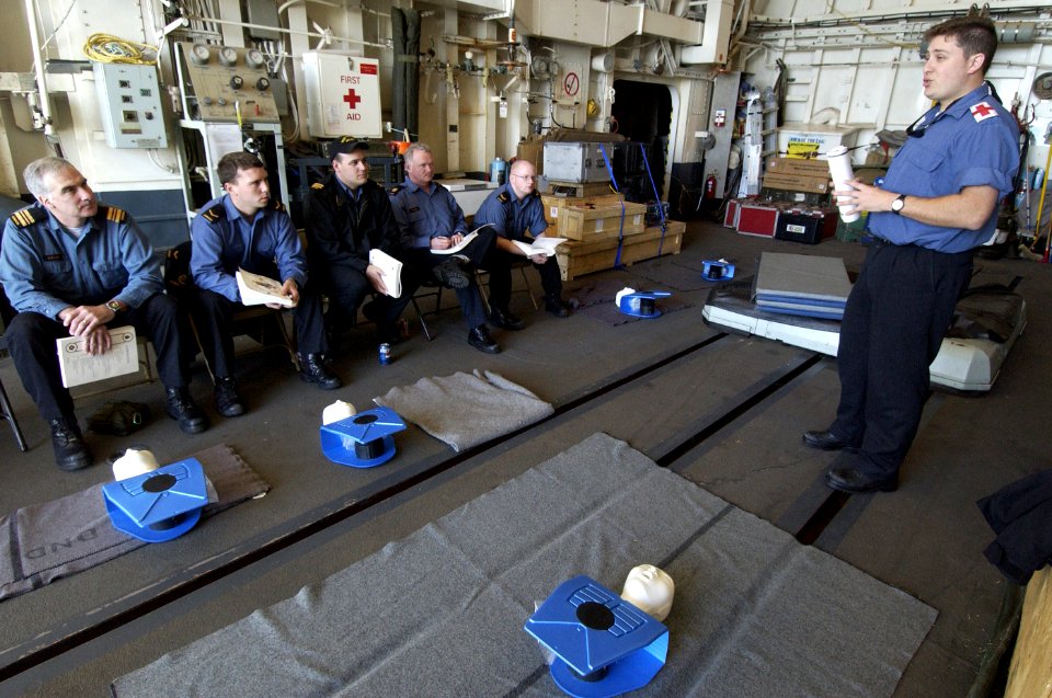 US Navy 040212-N-5319A-014 Canadian crewmember Cpl. Mike Thomasen conducts first aid training in the ship's hangar bay aboard the Canadian patrol frigate HMCS Toronto (FFH 333)