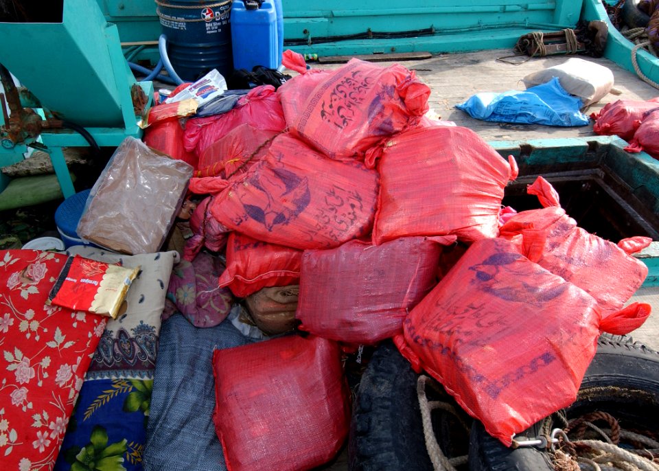 US Navy 031216-N-4374S-001 A U.S. Navy boarding team operation from the guided missile destroyer USS Decatur (DDG 73) discovered over 50 bags of hashish, weighting 70 pound each