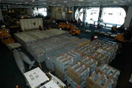 US Navy 031111-N-3986D-002 The hangar bay aboard the nuclear powered air craft carrier USS George Washington (CVN 73) is staged with weapons transferred from the Military Sealift Command ship USNS Supply (T-AOE 6)