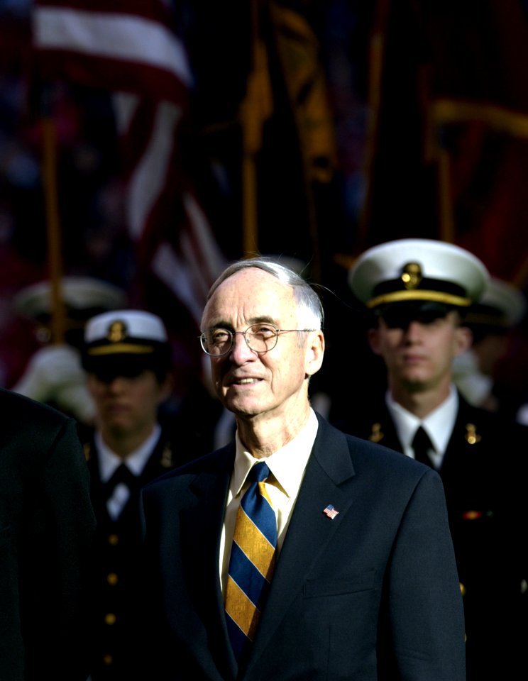 US Navy 031230-N-9693M-002 The Secretary of the Navy, the Honorable Gordon R. England following the march on of the Midshipmen during opening the opening ceremonies for the EV1.Net Houston Bowl at Reliant Stadium in Houston, Te