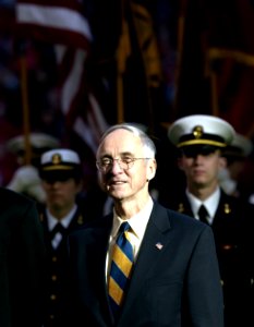 US Navy 031230-N-9693M-002 The Secretary of the Navy, the Honorable Gordon R. England following the march on of the Midshipmen during opening the opening ceremonies for the EV1.Net Houston Bowl at Reliant Stadium in Houston, Te