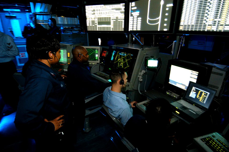US Navy 031217-N-6278K-001 Air Traffic Controllers man the Carrier Air Traffic Control Center (CATCC) during flight operations aboard USS George Washington (CVN 73)