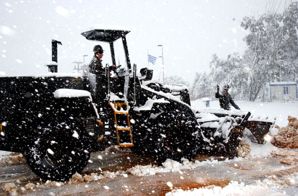US Navy 040213-N-0780F-082 Equipment Operator Constructionman Travis Brant, of Summerset, Pa., operates a front-end loader to clear snow