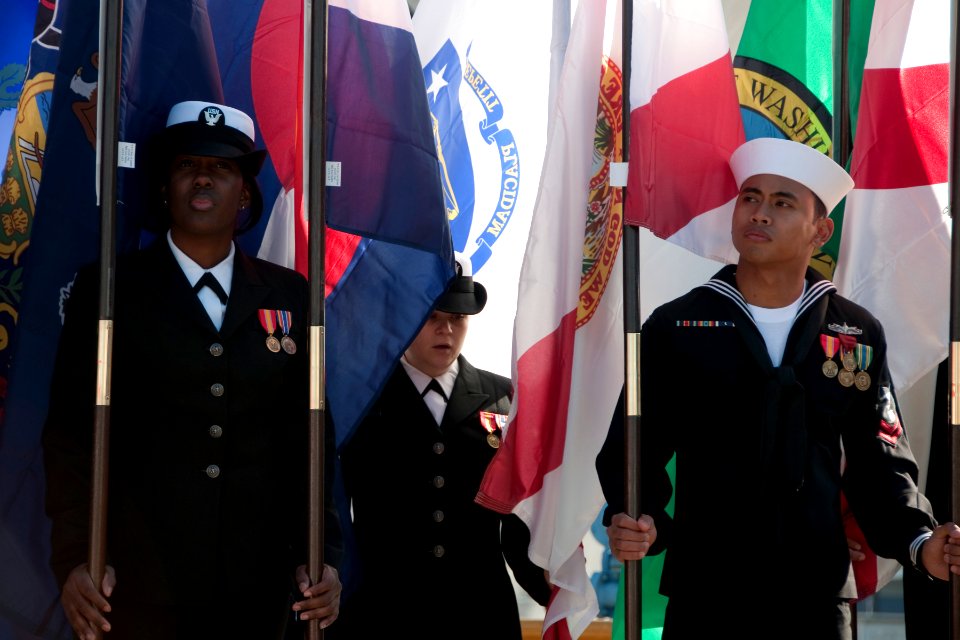 US Navy 101217-N-5758H-004 Sailors stand at ease as flag holders during the change of command ceremony of USS Lassen (DDG 82)